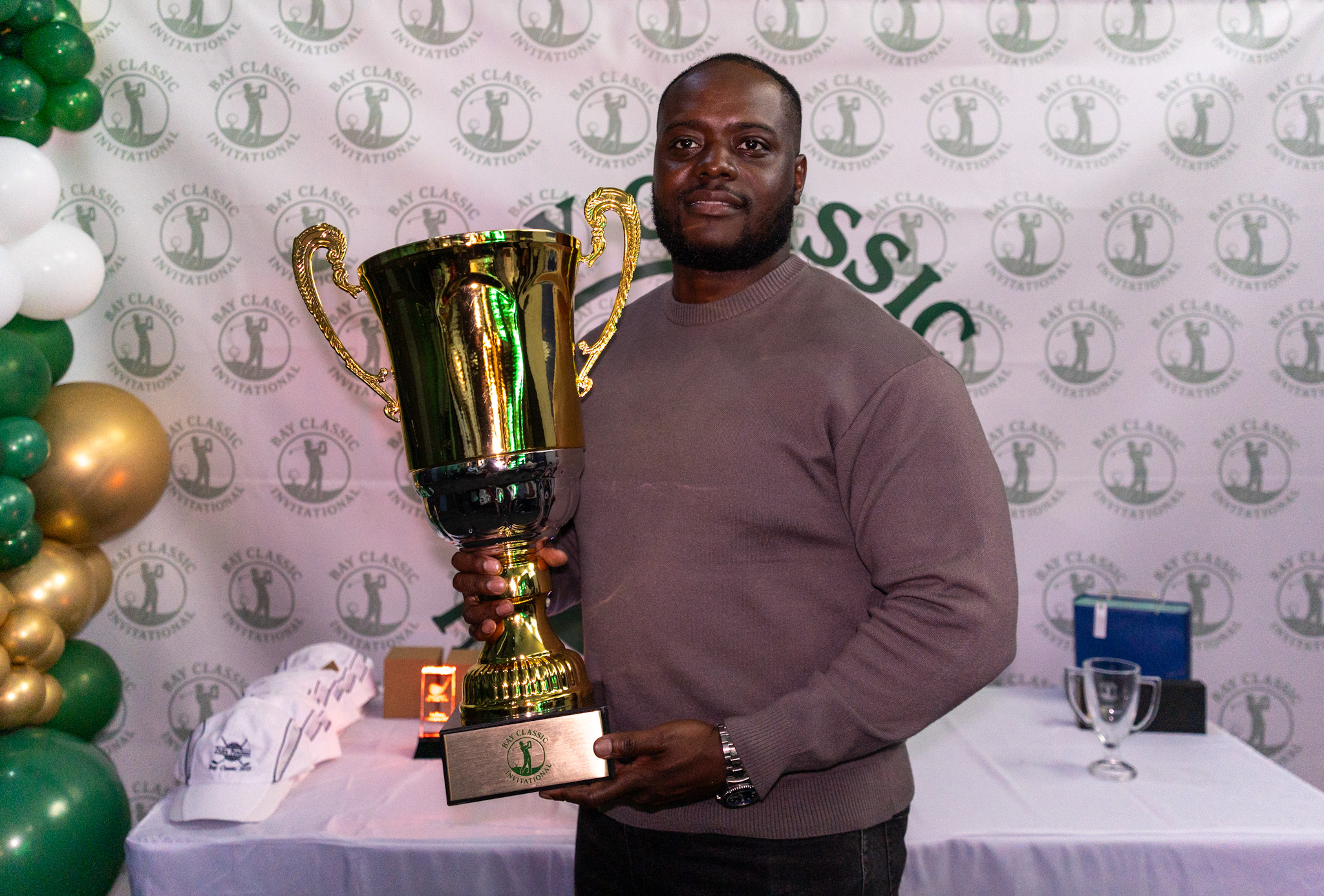 Golfers on the green at the inaugural Bay Classic